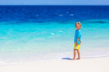 Kids playing on beach. Children play at sea.