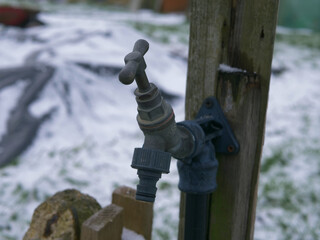 Faucet tap in garden in winter