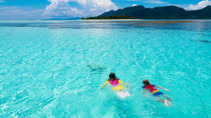 Kids snorkel. Children snorkeling in tropical sea.