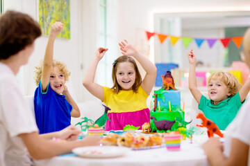 Obraz na płótnie Canvas Kids birthday party. Dinosaur theme cake.