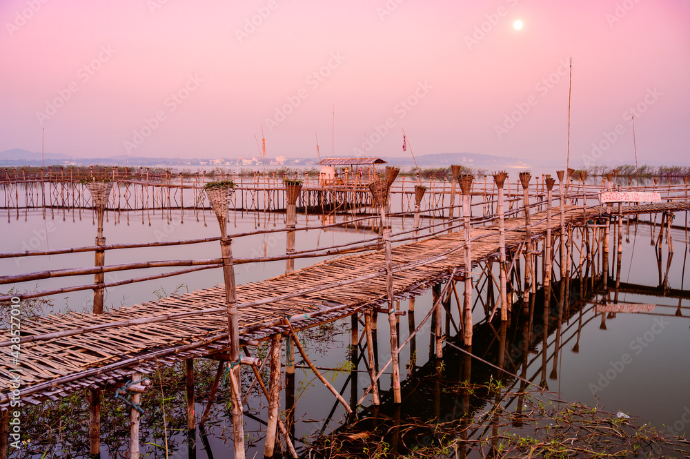 Canvas Prints Small Wooden Bridge with Soft Water in Kwan Phayao Lake