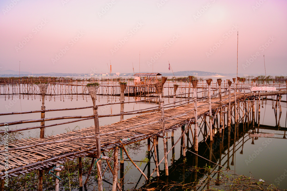 Canvas Prints Small Wooden Bridge with Soft Water in Kwan Phayao Lake