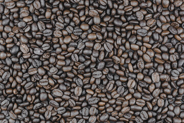 Top view of roasted coffee bean background.