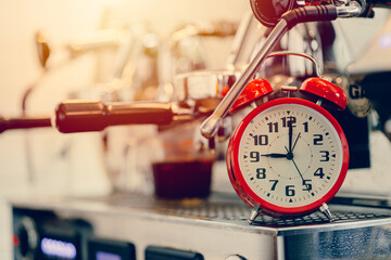 Brew time, Alarm clock with espresso machine for making coffee timing concept