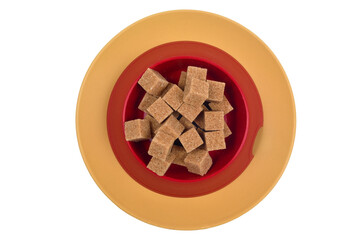 There is an animal bowl with cane sugar on a ceramic plate