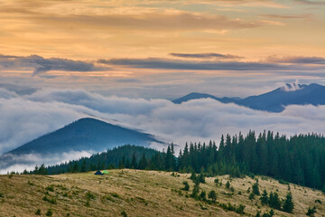 Fototapeta na wymiar sunrise in the mountains Dawn in the Carpathians. Fog and mountains