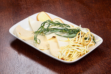 Caucasian tradition cheese plate served herbs