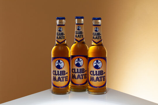 Club-Mate bottles on the glass table.