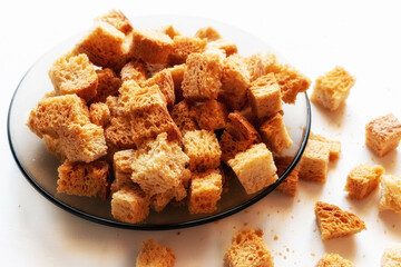 homemade rusks croutons of white crispy bread crackers on the plate