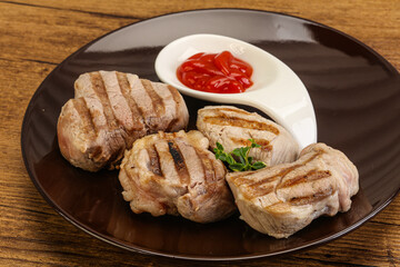 Grilled pork tenderlion with tomato sauce