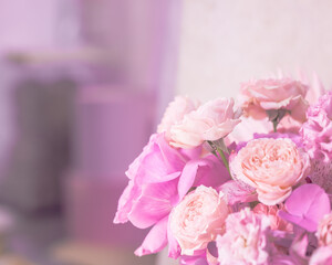 Light pink, purple, peach colour, white cute delicate small roses of different sizes, flowers in a round lush bouquet. Place for text