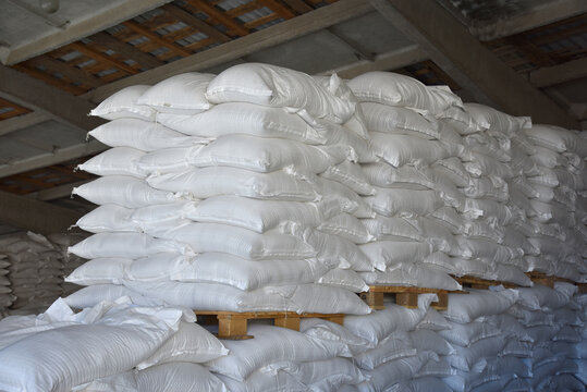 Bags of fertilizers are stacked on wooden pallets, the warehouse of the plant.