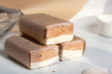 Portion marshmallow with cocoa and cranberries. Wrapped in paper and tied with string. Two-layer zephyr.