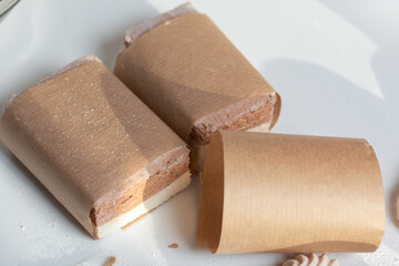 Portion marshmallow with cocoa and cranberries. Wrapped in paper and tied with string. Two-layer zephyr.