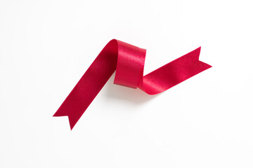 A roll red ribbon isolated on white