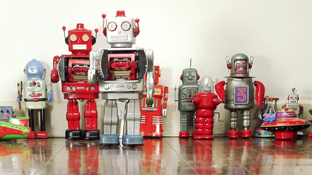big silver robot walking on an old wooden floor 