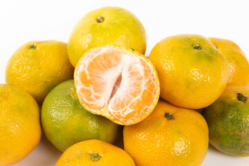 peeled and whole tangerines isolated on white background