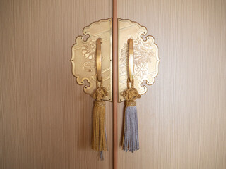 golden handles on the chest