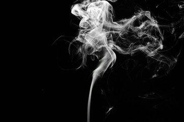 abstract fragment movement of white smoke on black background.