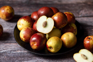 fres sliced chinese jujubes on wood background
