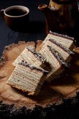 Baumkuchen on black background, Slice of baumkuchen with chocolate.