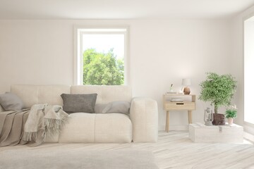 White living room with sofa and summer landscape in window. Scandinavian interior design. 3D illustration