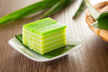 Kuih lapis is a traditional Malay nyonya sweet desert on wooden table