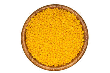 Yellow lentils in wooden bowl. Isolated on white background