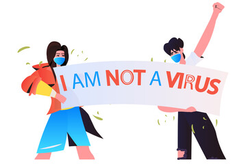 stop asian hate activists in masks protesting against racism support people during coronavirus pandemic concept