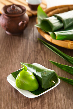 Kuih Koci, traditional Malaysian Nyonya sweet cake. Made from glutinous rice flour with coconut filling, wrapped in banana leaves and steamed.