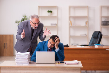 Two employees working in the office