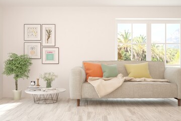 White living room with sofa and summer landscape in window. Scandinavian interior design. 3D illustration