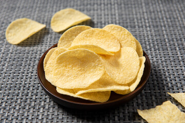 Group of potato chips in plate with clipping path