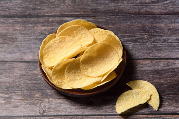 Group of potato chips on wood background with clipping path