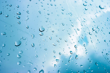 Rain drops on window glasses in rainy day with selective focusing