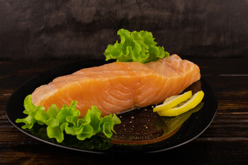 Red fish steak with herbs lemon and pepper