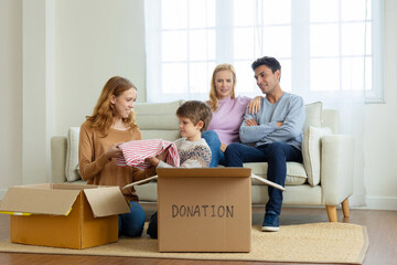 Happy family pick up waste items. Donation and reuse recycle.