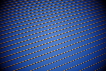 big yellow sling cable of bridge with blue sky background