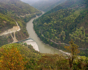 Obraz premium Beautiful forested landscape view on the Teesta river valley at junction with Rangeet river, near Namchi, Sikkim, India