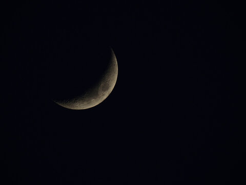 half moon on black sky background at night