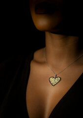 Fashion handmade Jewelry in a beautiful African Girl neck, on a black background. 