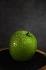green apple on a gray background