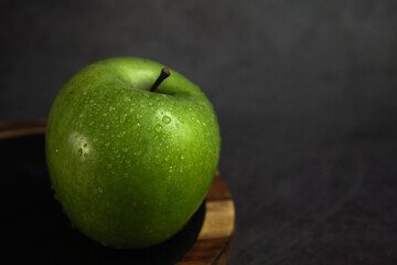 green apple on a gray background