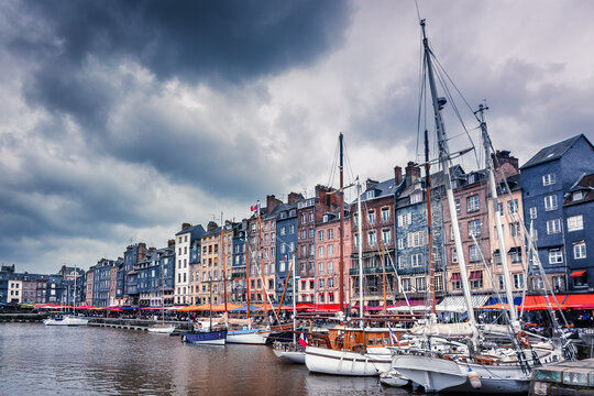 Honfleur, Normandy, France. Boats and colored buildings