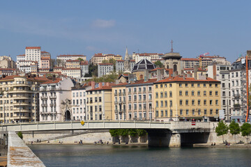 Fototapeta premium Facades of old buildings of Lyon France a bridge over the river Saône