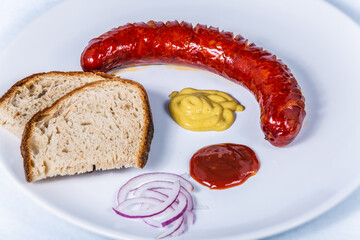Roast pork sausage with bread and dressing. The food in the restaurant. Food styling and restaurant meal serving.