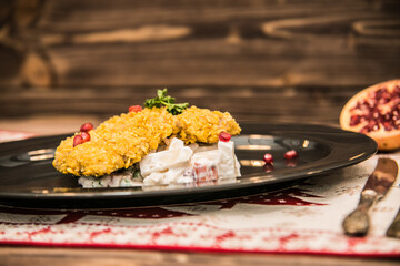 Fit salad with baked fish The food in the restaurant. Food styling and restaurant meal serving.