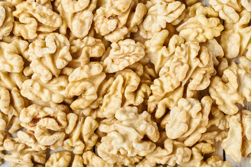 textured background of peeled walnuts close-up
