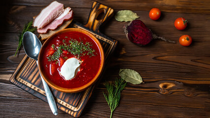 Ukrainian and Russian national Red Borscht on wooden surface. Beet Root delicious soup . Traditional Ukraine food cuisine. Top view. Flat lay,
