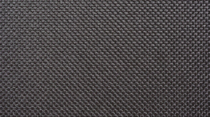 Texture of black synthetic fabric, Dark color tone of cloth pattern, Wallpaper background